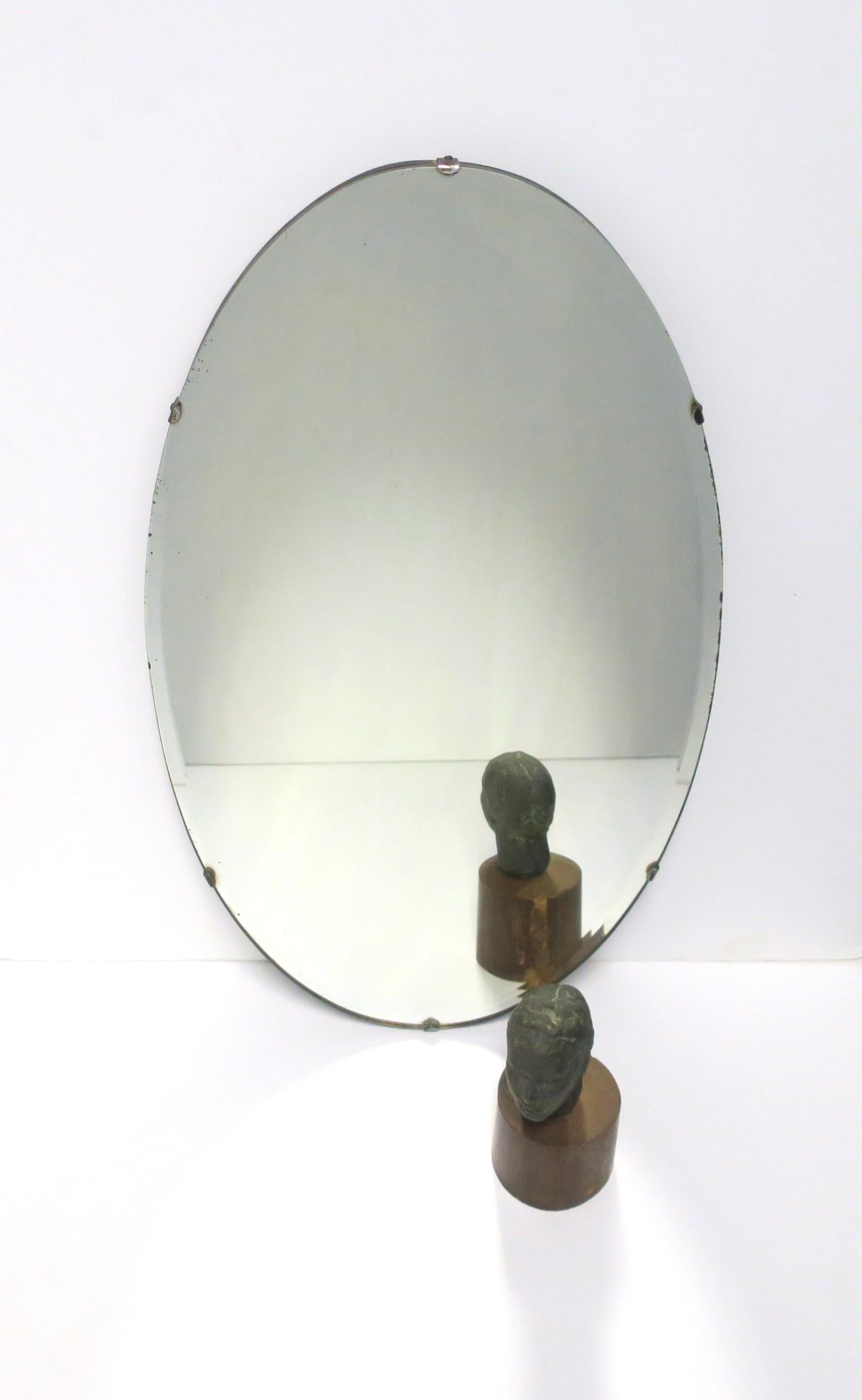 Beveled Oval Wall Mirror, circa Early 20th Century For Sale