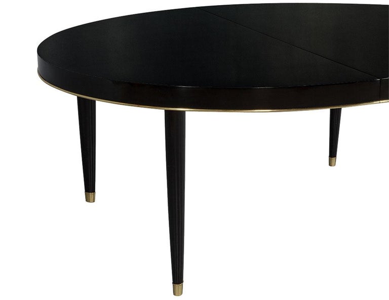 Oval Black Lacquer Dining Table with Brass Trim Accents at 1stDibs
