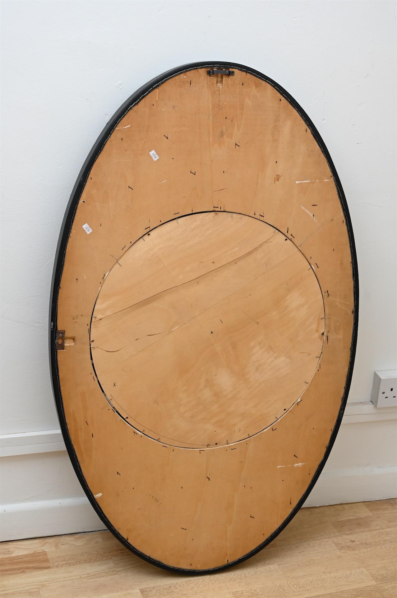 large oval black mirror