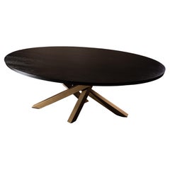 Table de salle  manger ovale en chne noir, base dore en croix croise