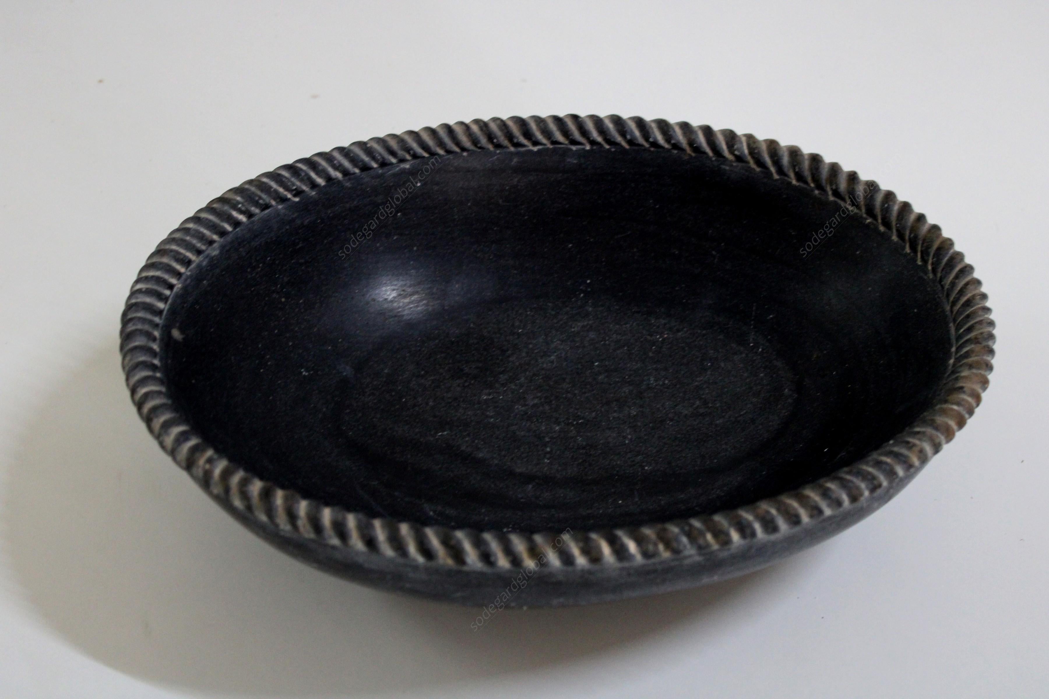 Sculpted out of a single block of marble with a delicately carved rope edge, perfect for a potpourri, a fruit bowl or just a key catch.


Oval Black Rope Bowl
Size- 14” x 11” x 4” H
Materials - Black Marble, Hand-Carved


Buyer Cancellation-
The
