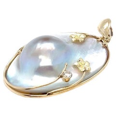 Oval Blister Pearl Pendant with Flower Accent