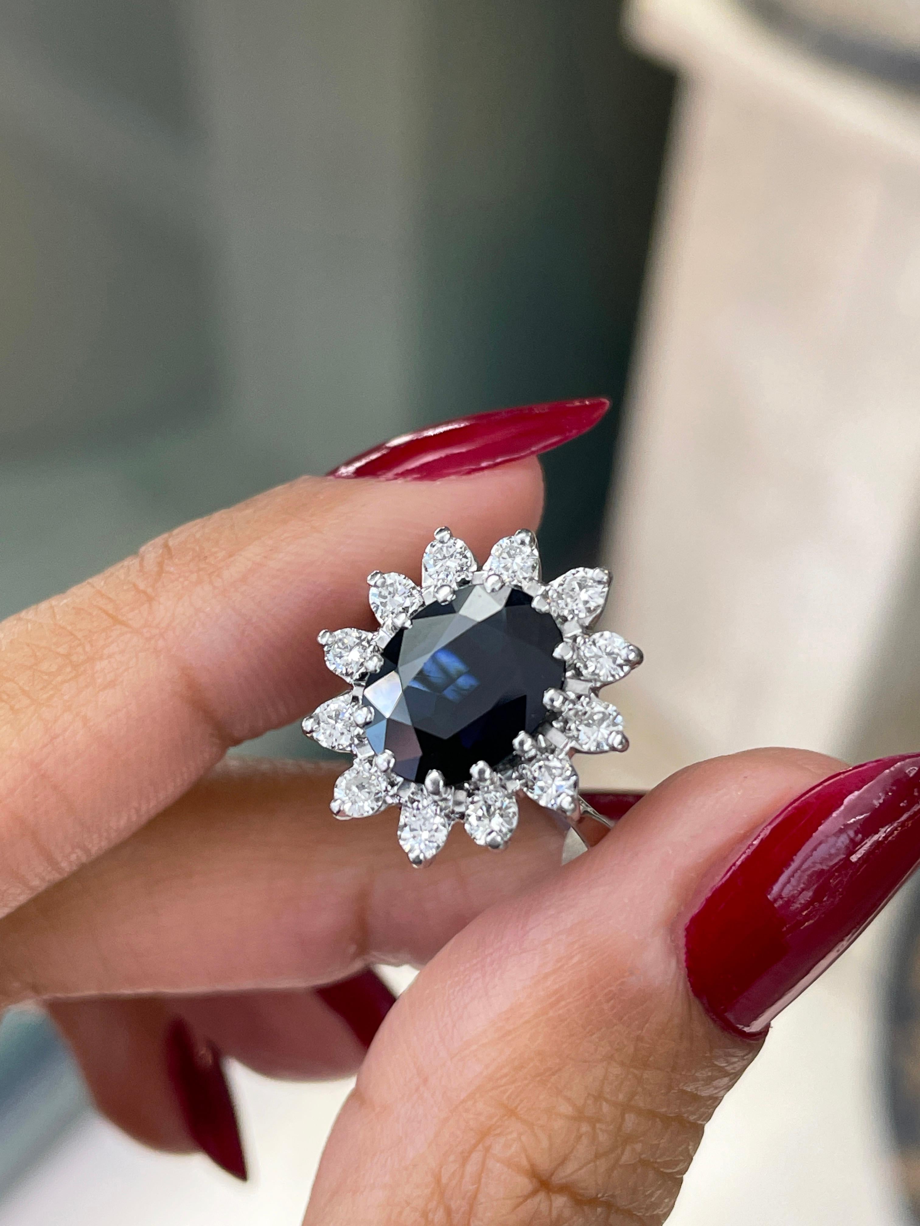 Oval Blue Sapphire and Diamond 18 Carat Gold Cluster Engagement Ring In Excellent Condition In London, GB