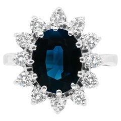 Bague de fiançailles en grappe en or 18 carats avec saphir bleu ovale et diamants