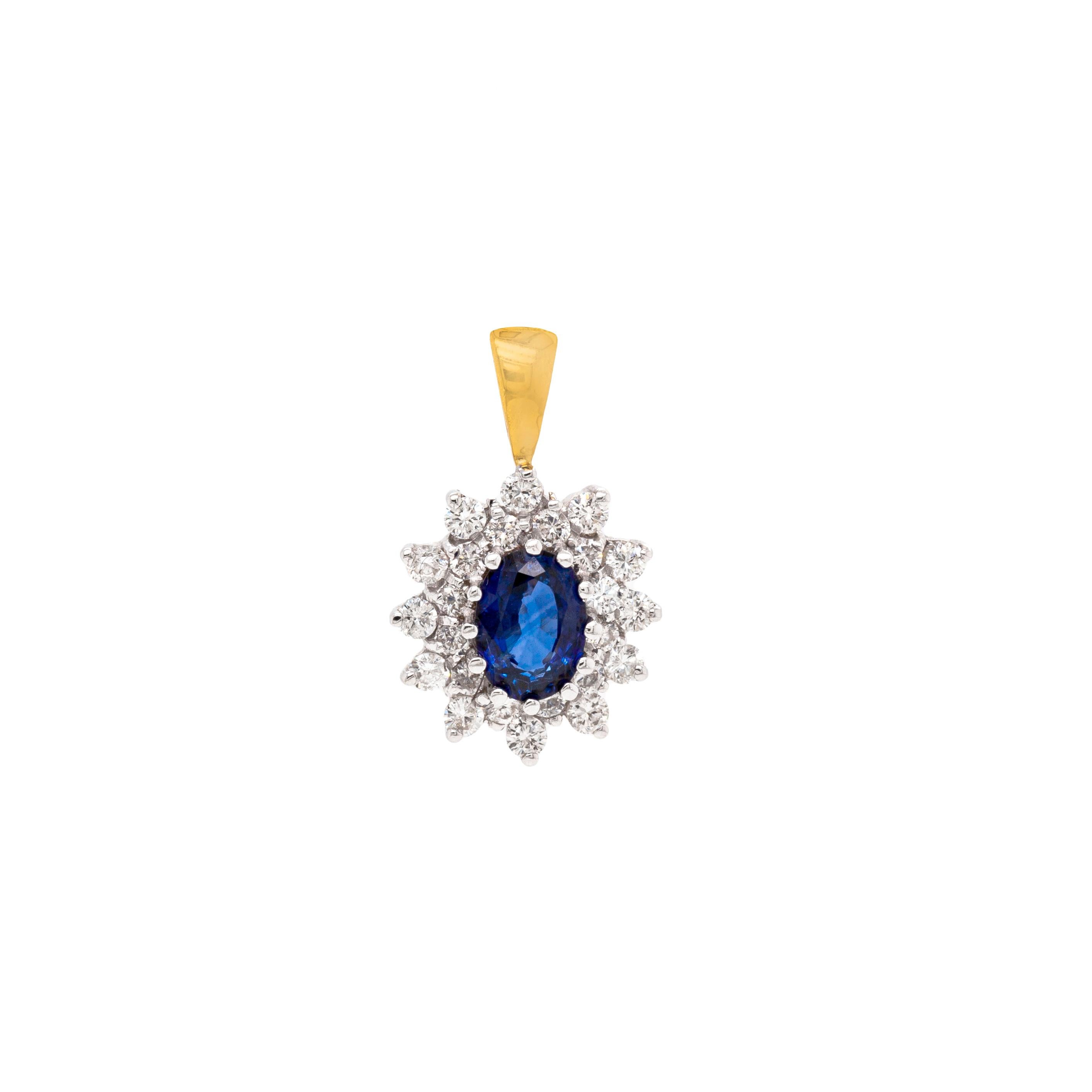 This gorgeous cluster pendant is beautifully centred with an oval blue sapphire weighing 0.75ct, mounted in a twelve claw, open back setting. A beautiful contrast to the vivid stone is given by 12 fine quality round brilliant cut diamonds, all
