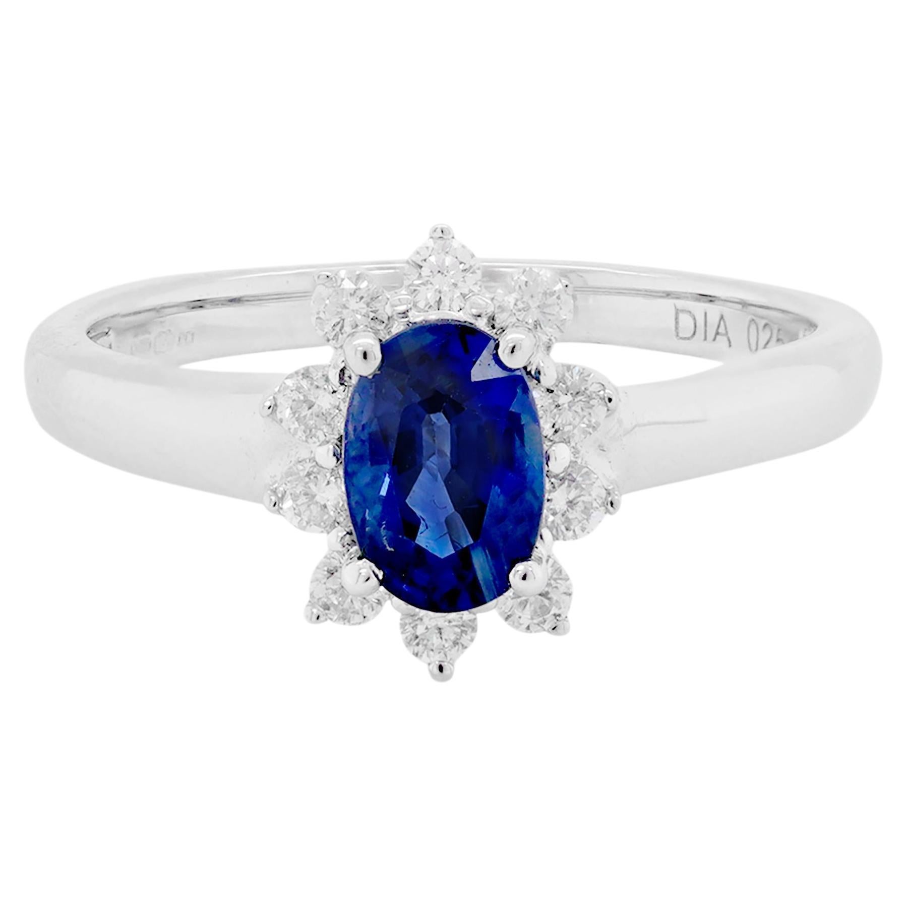 Oval Blue Sapphire and Diamond 18 Carat White Gold Cluster Engagement Ring For Sale