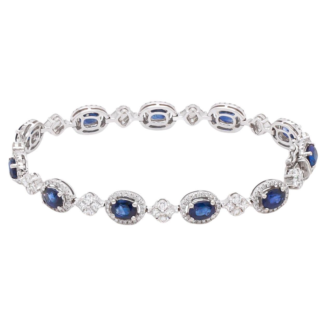 Bracelet en or blanc 18 carats avec saphir bleu ovale et grappe de diamants