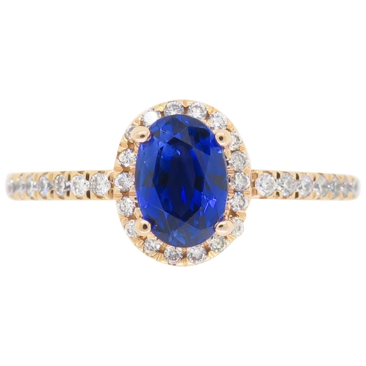 Oval Blue Sapphire and Diamond Halo Ring in 14 Karat Rose Gold