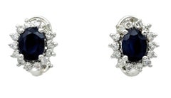 Oval Blue Sapphire and Diamond Halo Stud Earrings in 14 Karat White Gold