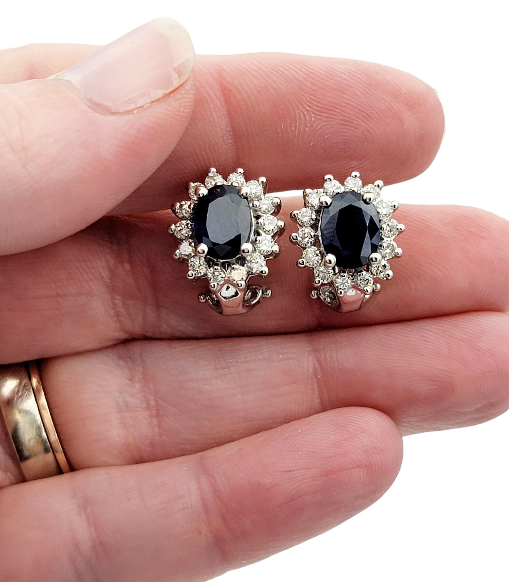Oval Cut Oval Blue Sapphire and Diamond Halo Stud Earrings in 14 Karat White Gold For Sale