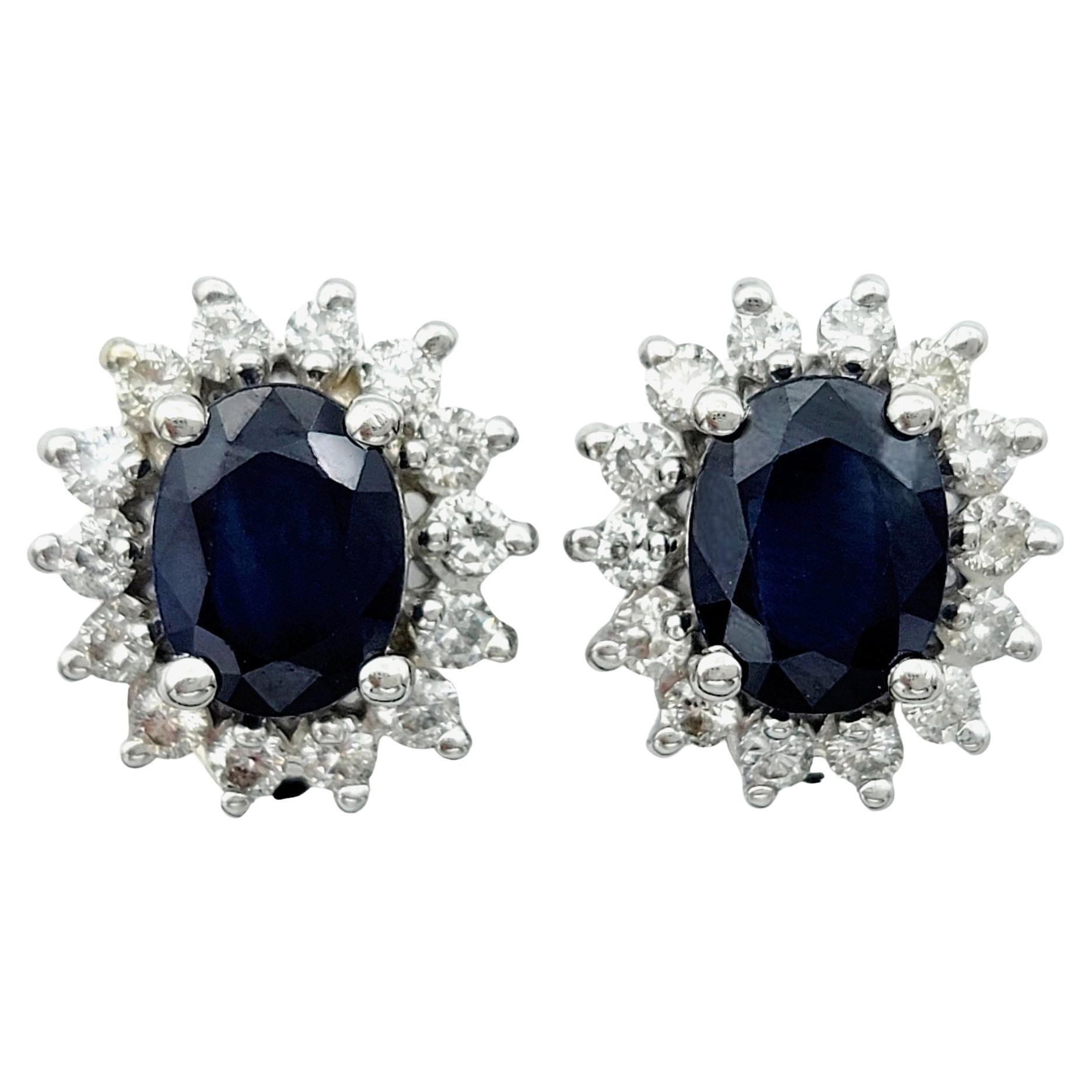 Oval Blue Sapphire and Diamond Halo Stud Earrings in 14 Karat White Gold For Sale
