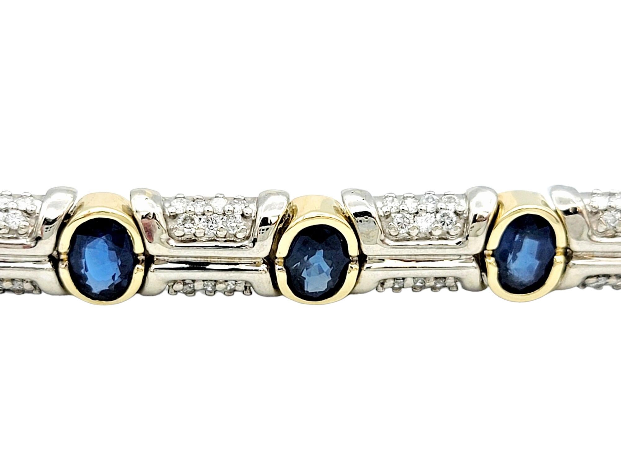 Adorn your wrist with the captivating beauty of this two-toned tennis bracelet, a masterful creation that seamlessly blends 14 karat white and yellow gold. The bracelet features a mesmerizing alternation of bezel-set sapphires and diamonds, each