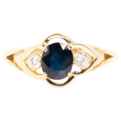 Oval Blue Sapphire and Diamond Vintage Three Stone Ring in 18 Carat Yellow Gold