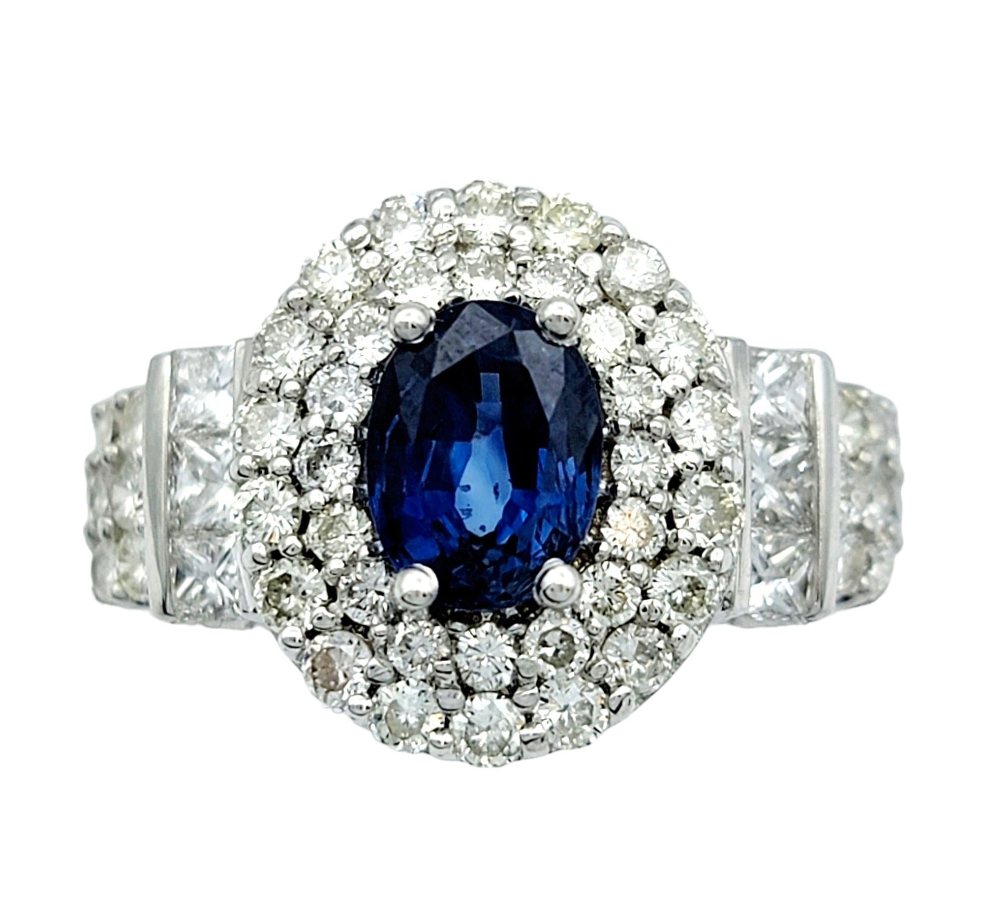 Contemporary Oval Blue Sapphire and Double Diamond Halo Cocktail Ring in 14 Karat White Gold For Sale