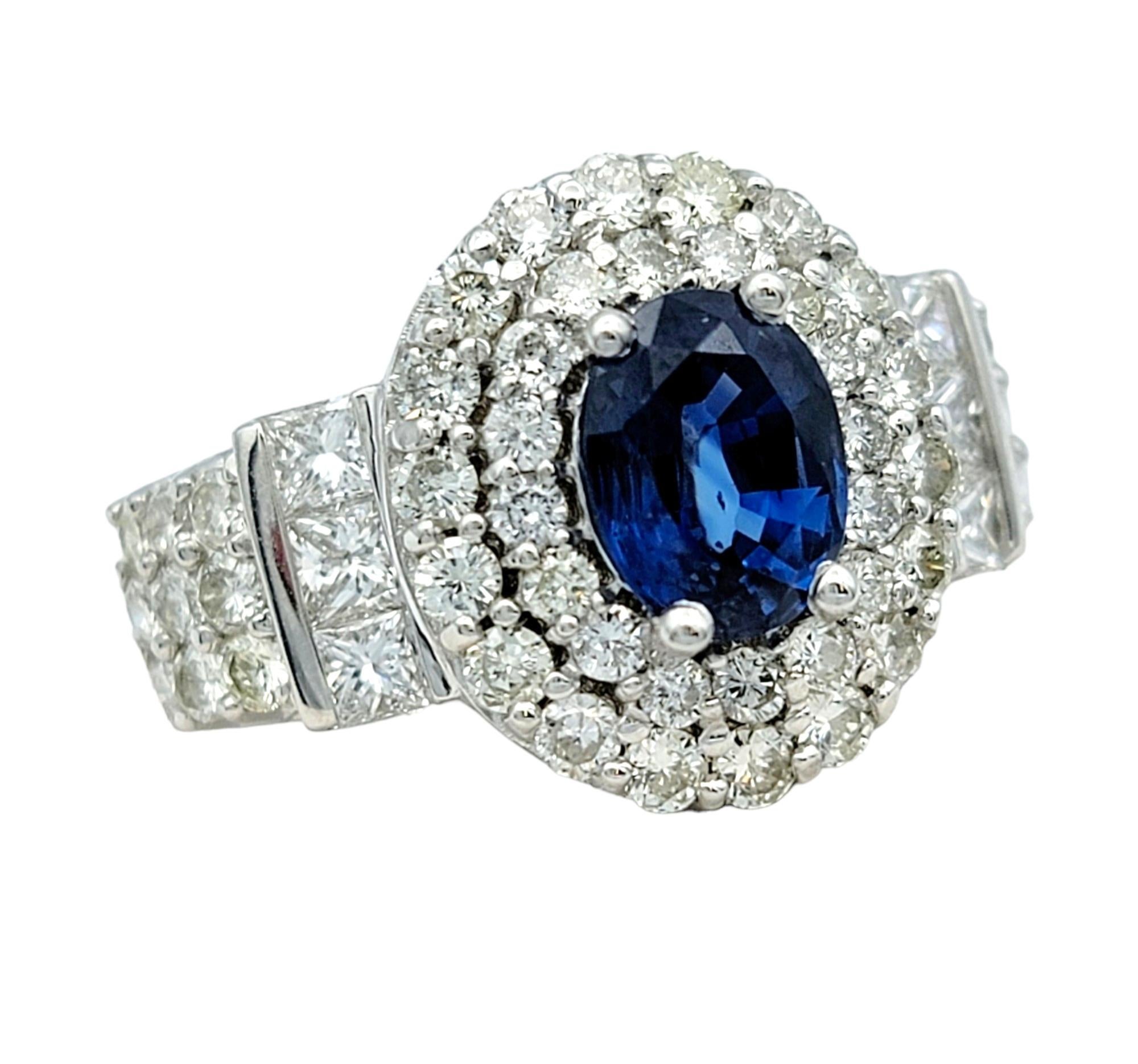 Oval Cut Oval Blue Sapphire and Double Diamond Halo Cocktail Ring in 14 Karat White Gold For Sale