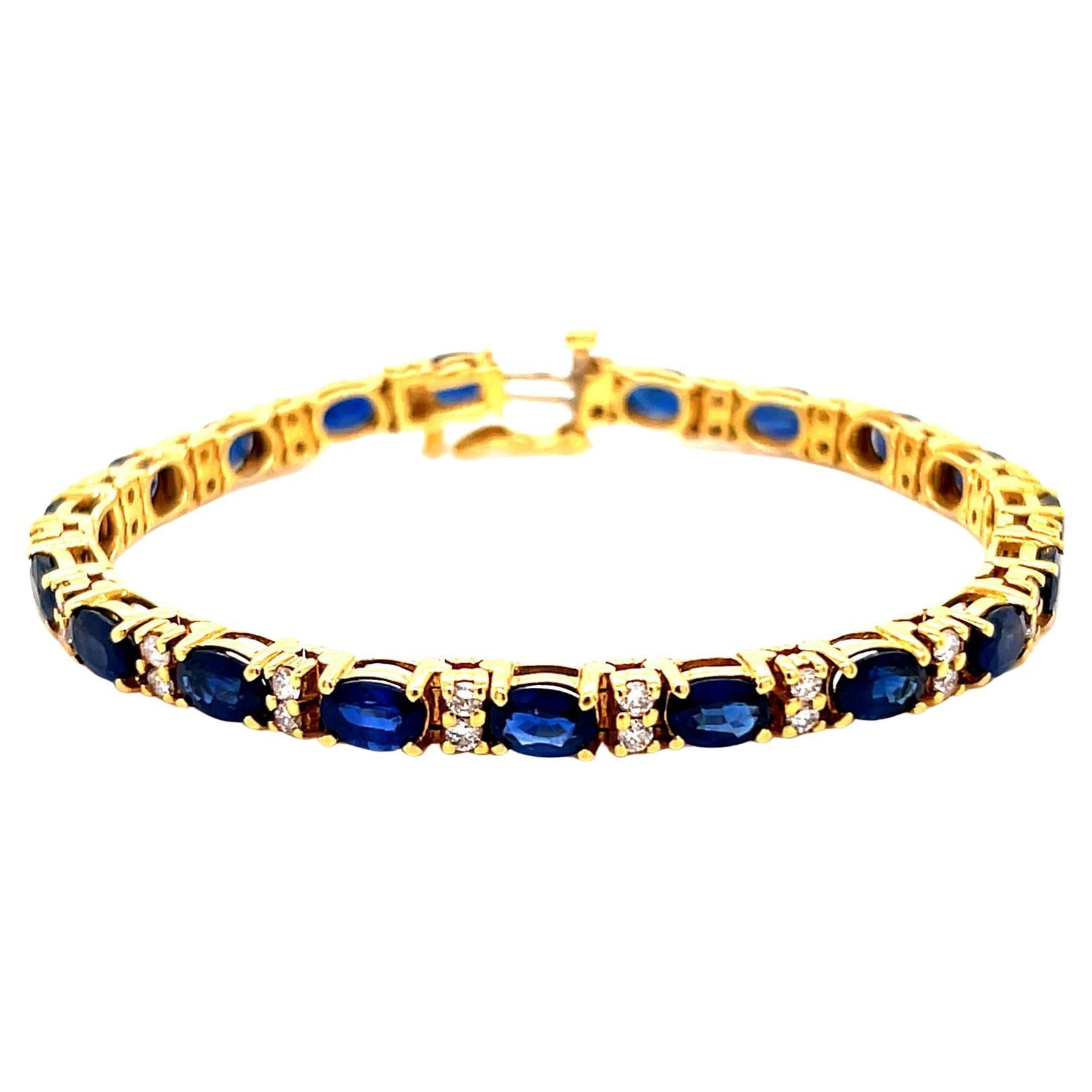 Armband mit ovalem blauem Saphir und rundem Diamanten, gefasst in 18K Gelbgold