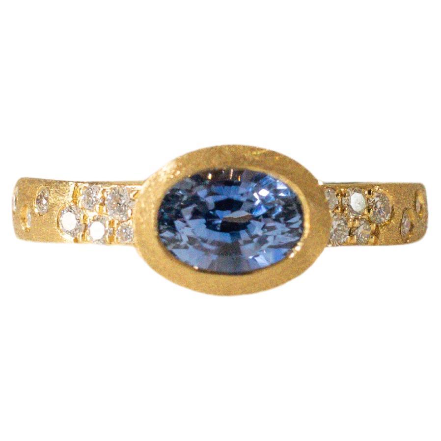 Oval Blue Sapphire Bezel Ring with Diamonds in 18K Yellow Gold