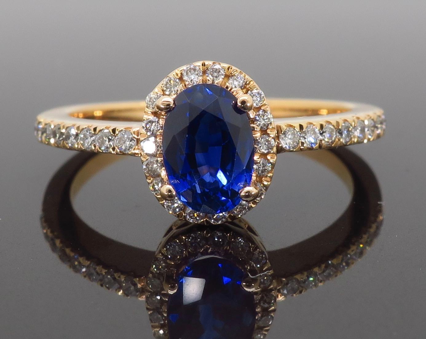 Oval Cut Oval Blue Sapphire and Diamond Halo Ring in 14 Karat Rose Gold