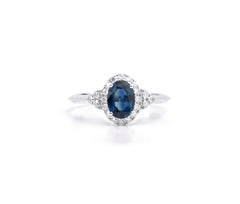 0.7ct Oval Blue Sapphire & Diamond Halo Cluster Engagement Ring in 18K WhiteGold