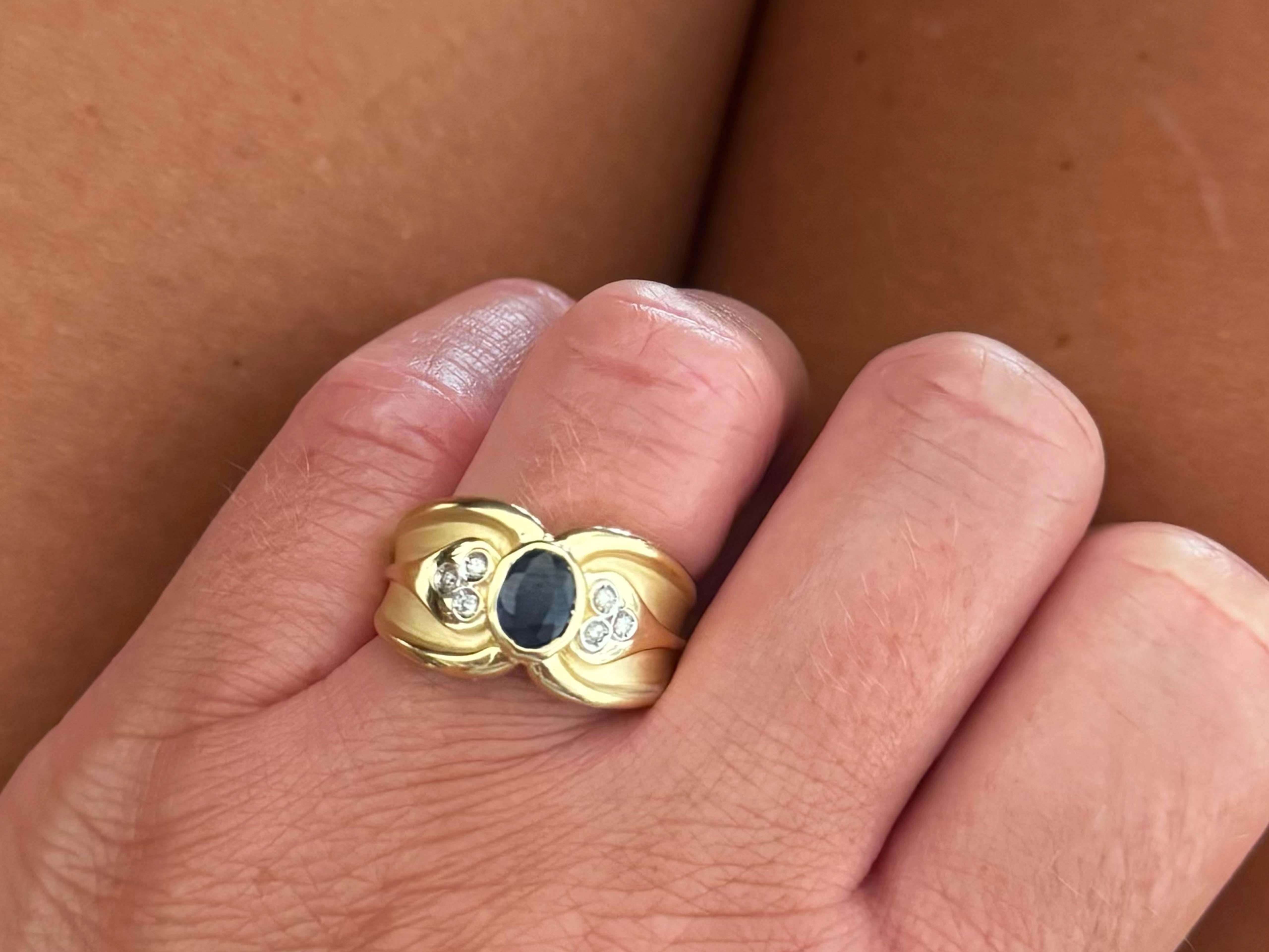 Ring Specifications:

Metal: 18k Yellow Gold

Total Weight: 7.7 Grams

Sapphire Count: 1 oval blue sapphire

Sapphire Measurements: ~6.9 mm x 5.3 mm x 2.3 mm

Sapphire Carat Weight: ~0.61 carats

Diamond Count: 6 brilliant cut

Diamond Color: