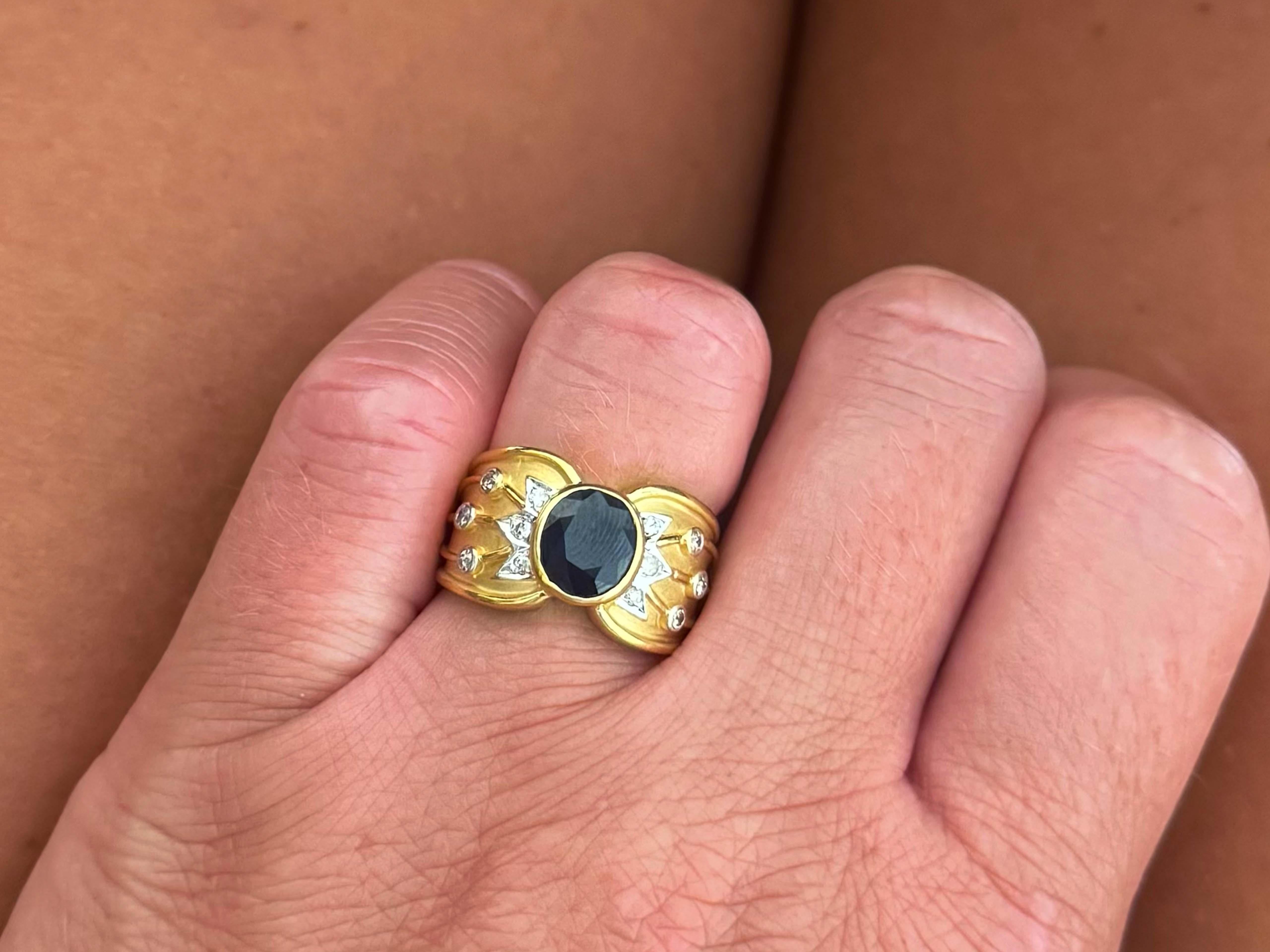 Ring Specifications:

Metal: 18k Yellow Gold

Total Weight: 8.7 Grams

Sapphire Count: 1 oval blue sapphire

Sapphire Measurements: ~8.0 mm x 7.0 mm x 4.7 mm

Sapphire Carat Weight: ~2.01 carats

Diamond Count: 12 brilliant cut

Diamond Color: