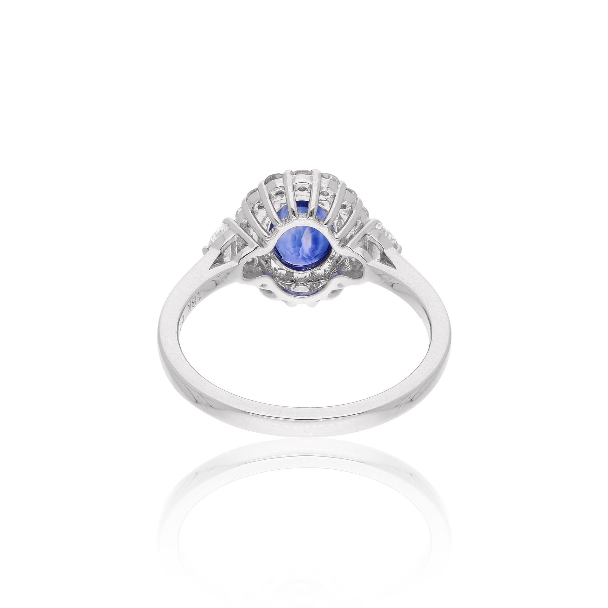 A cocktail ring featuring an oval blue sapphire gemstone and diamonds in 18 karat white gold is a stunning and elegant piece of jewelry. The ring typically showcases a central oval-shaped blue sapphire gemstone as the centerpiece.

The ring is a