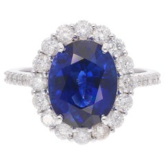 Bague en or blanc 18 carats avec saphir bleu ovale de pureté SI et diamants de couleur HI