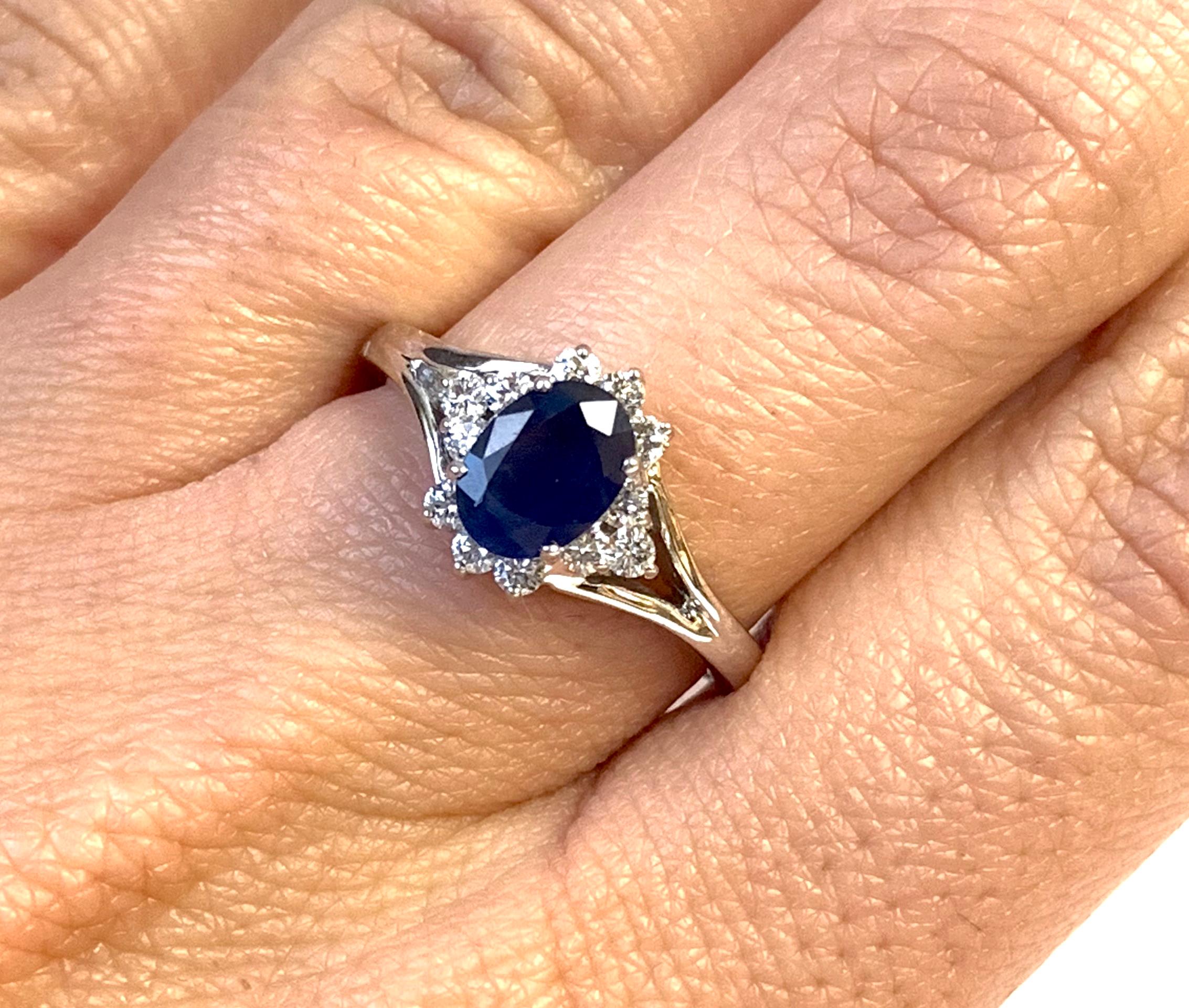 Material: 14k White Gold
Gemstones: 1 Oval Blue Sapphire at 0.92 Carats. 
Diamonds: 12 Brilliant Round White Diamonds at 0.22 Carats. SI Clarity / H-I Color. 
Ring Size: 6.25 (Can be sized)

Fine one-of-a-kind craftsmanship meets incredible quality