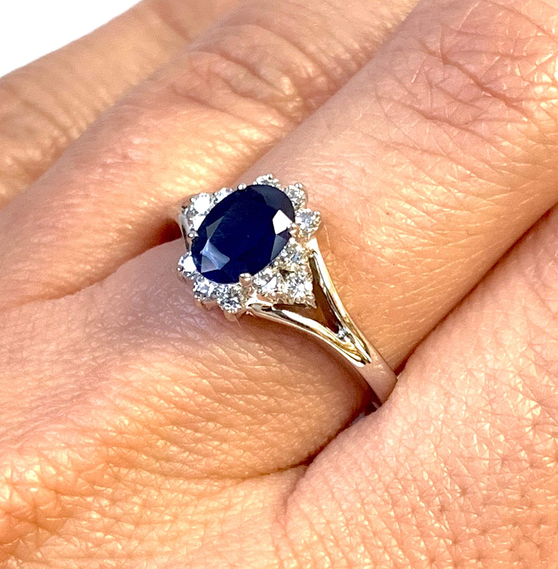 Contemporary Oval Blue Sapphire Halo Engagement Ring