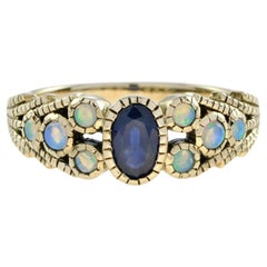Bague en or jaune, saphir bleu ovale et opale, style antique et inspiré du vintage