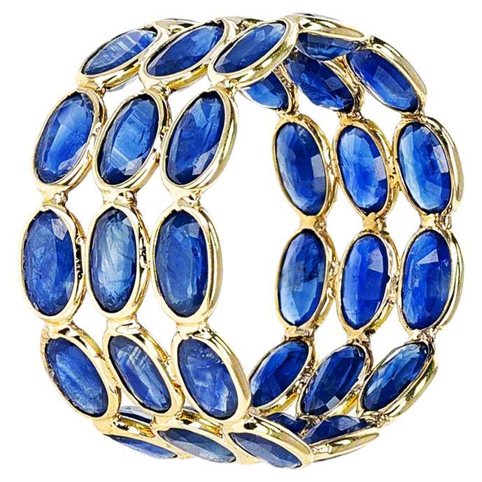 Shape: Oval

Stone: Blue Sapphire

Metal: 14 Karat Yellow Gold (can be customized)

Style: Triple Layer Band

Ring Size: US 6 (can be customized)

Stone Weight: appx. 9 carats of Sapphires 

Total Weight: 3 grams