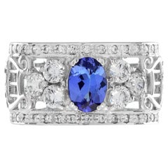 Anillo ancho de tanzanita azul ovalada y diamantes estilo eduardiano