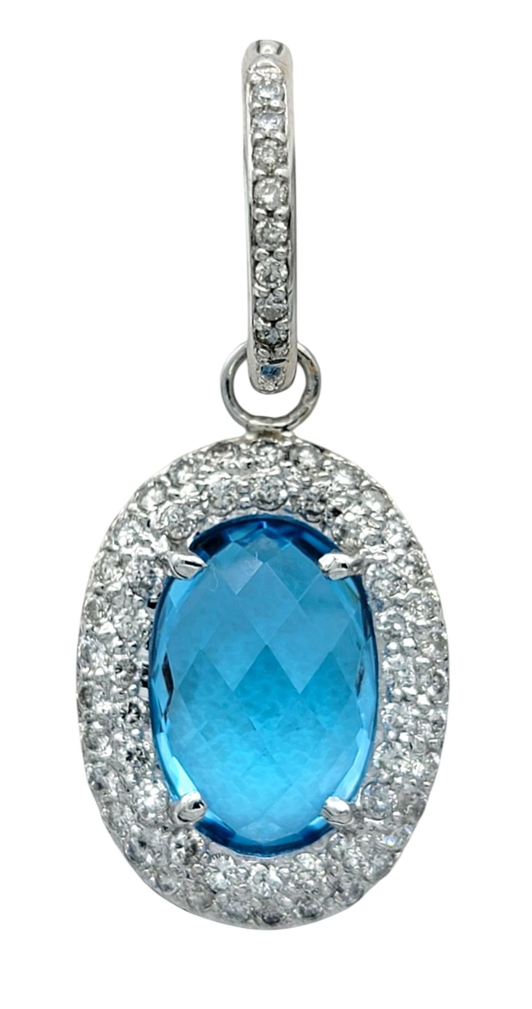 Contemporary Oval Blue Topaz and Diamond Halo Huggie Dangle Earrings in 14 Karat White Gold For Sale