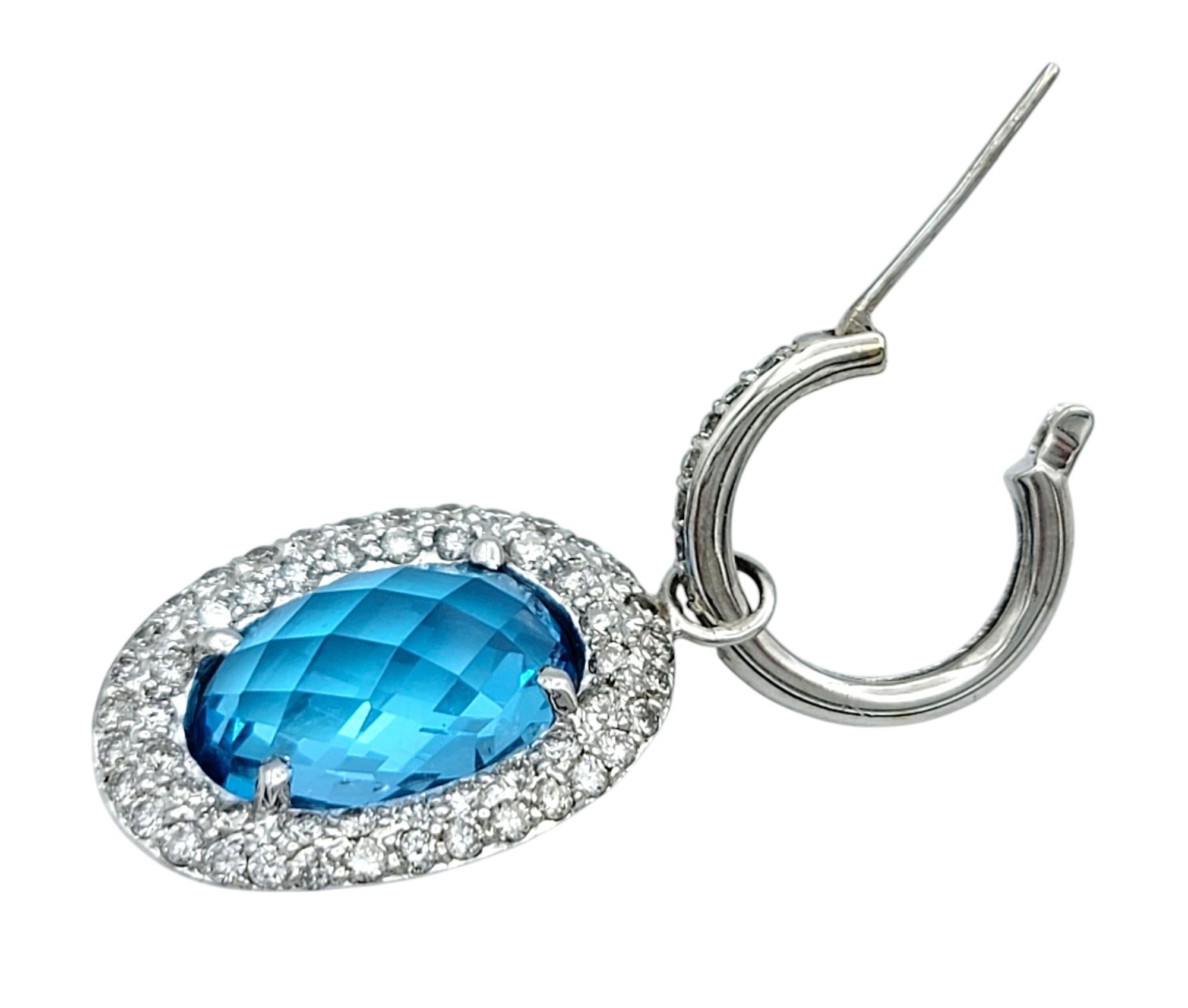 Oval Cut Oval Blue Topaz and Diamond Halo Huggie Dangle Earrings in 14 Karat White Gold For Sale