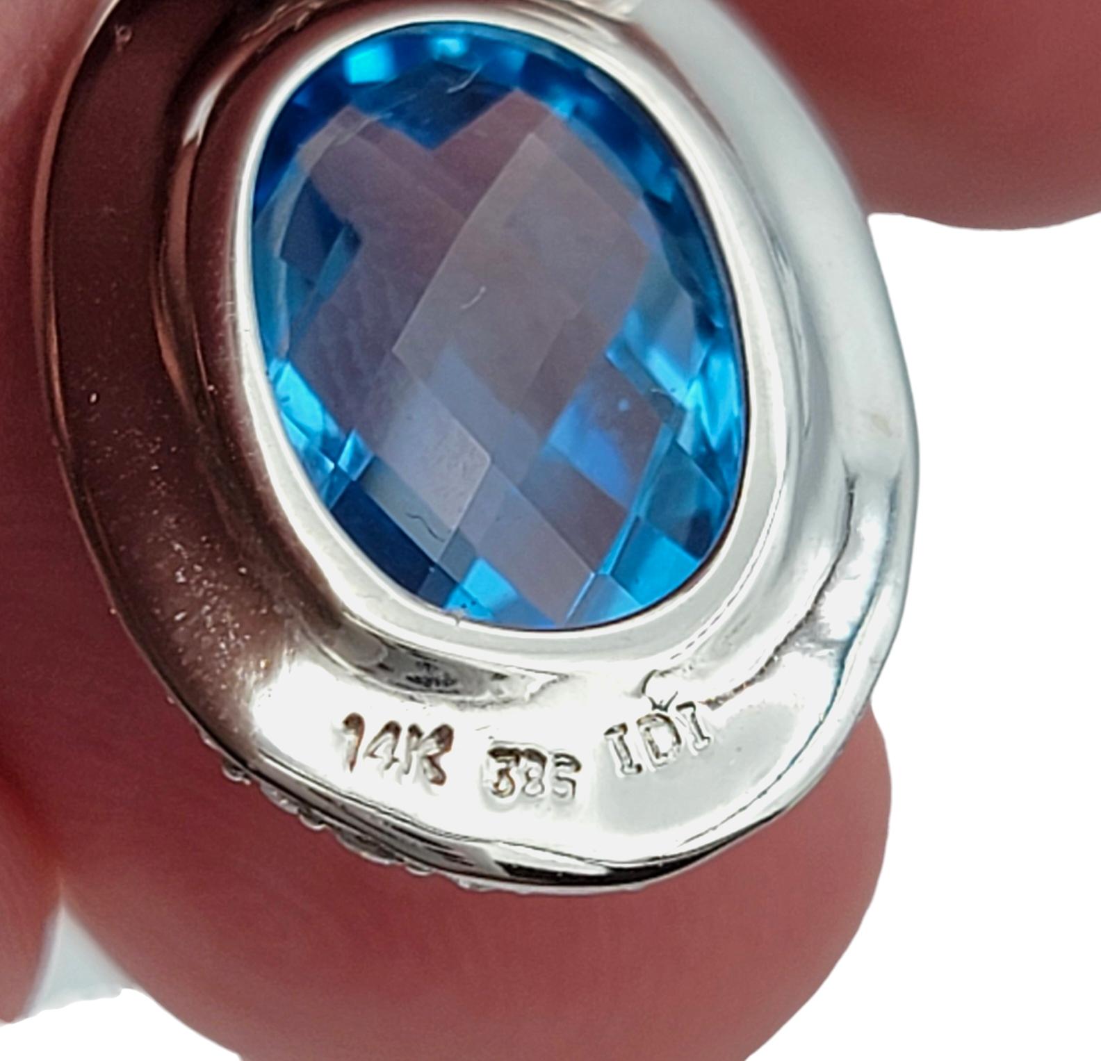 Women's Oval Blue Topaz and Diamond Halo Huggie Dangle Earrings in 14 Karat White Gold For Sale