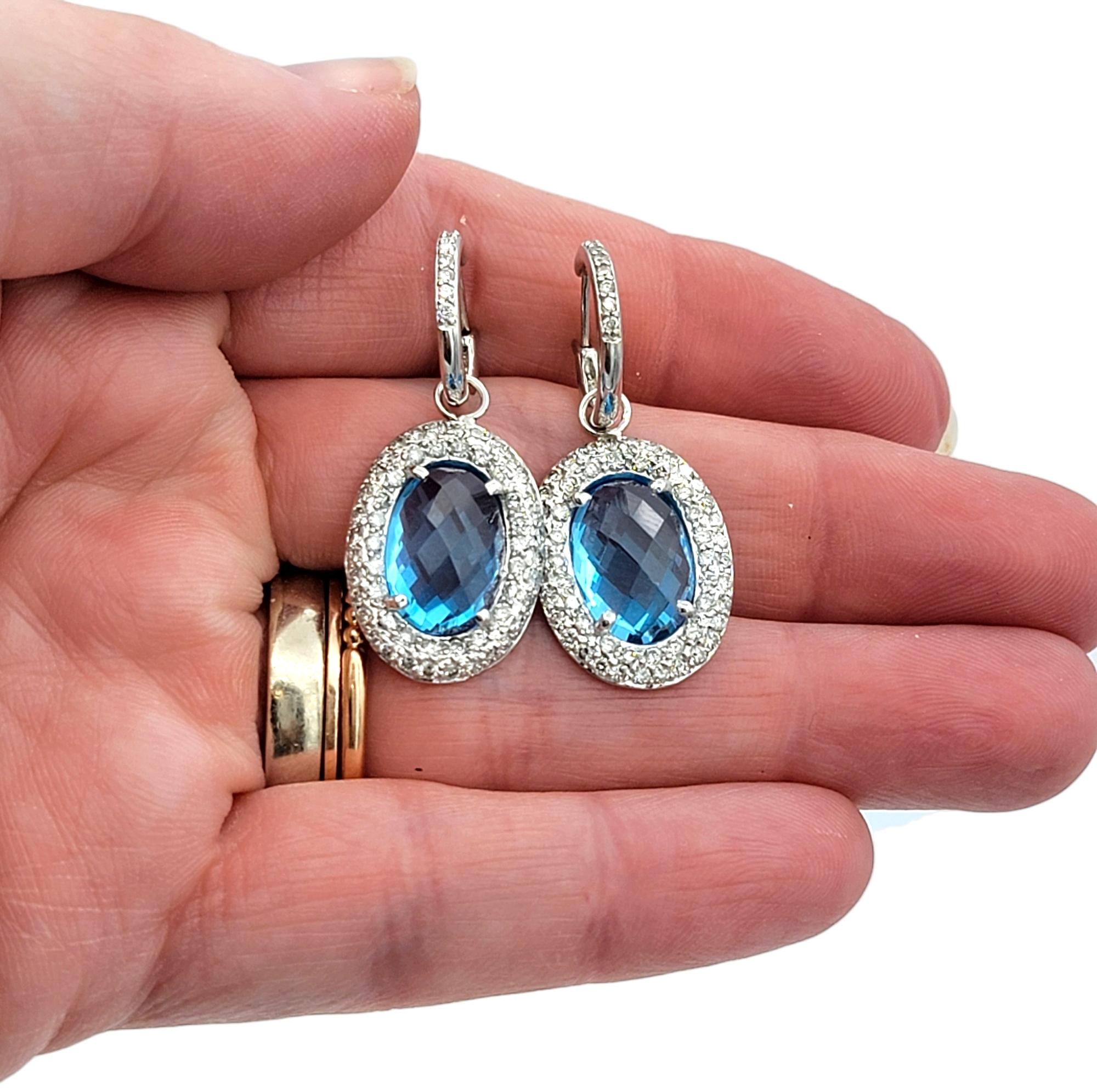 Oval Blue Topaz and Diamond Halo Huggie Dangle Earrings in 14 Karat White Gold For Sale 1