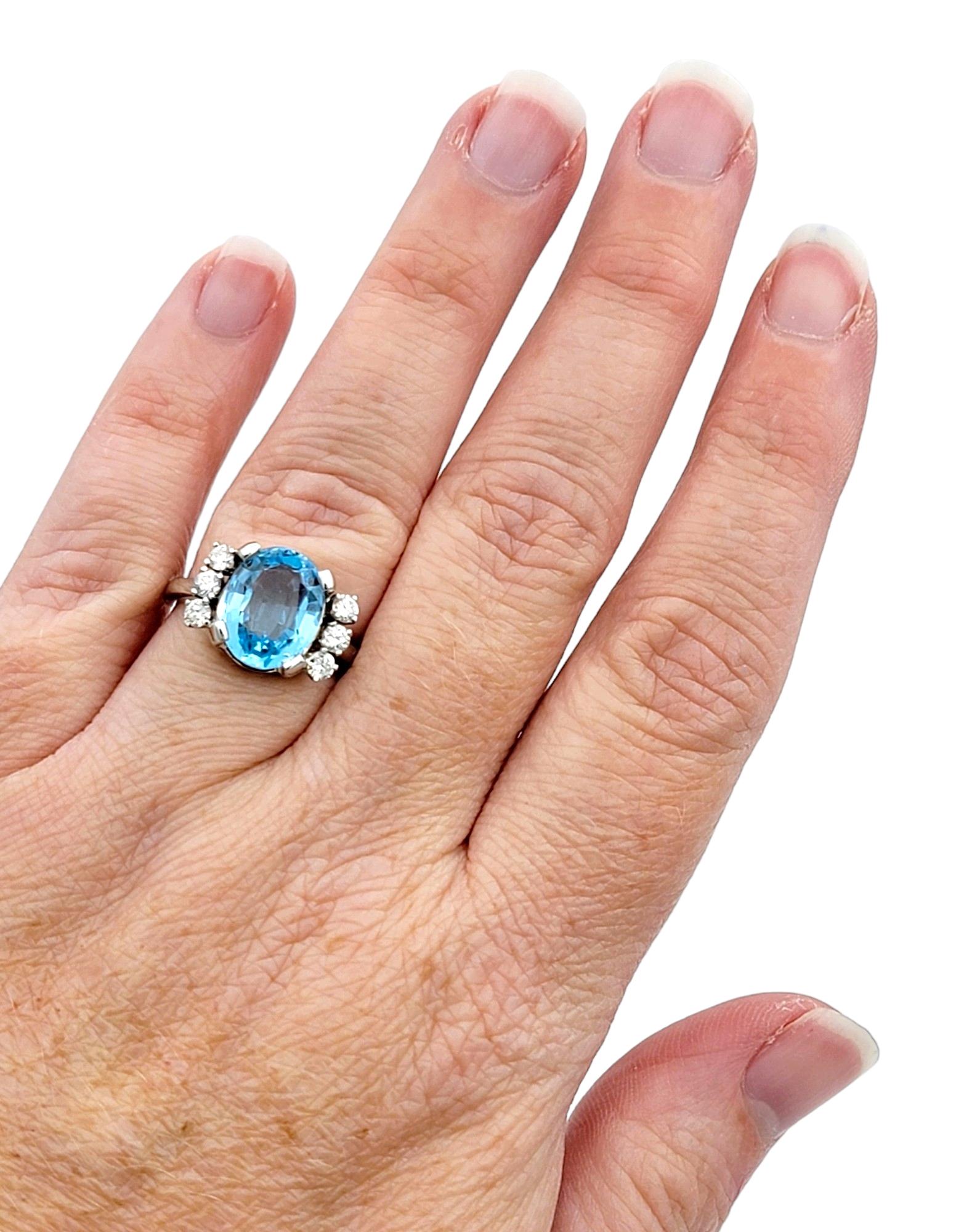 Oval Blue Topaz and Round Diamond Flanked Cocktail Ring in 14 Karat White Gold For Sale 1