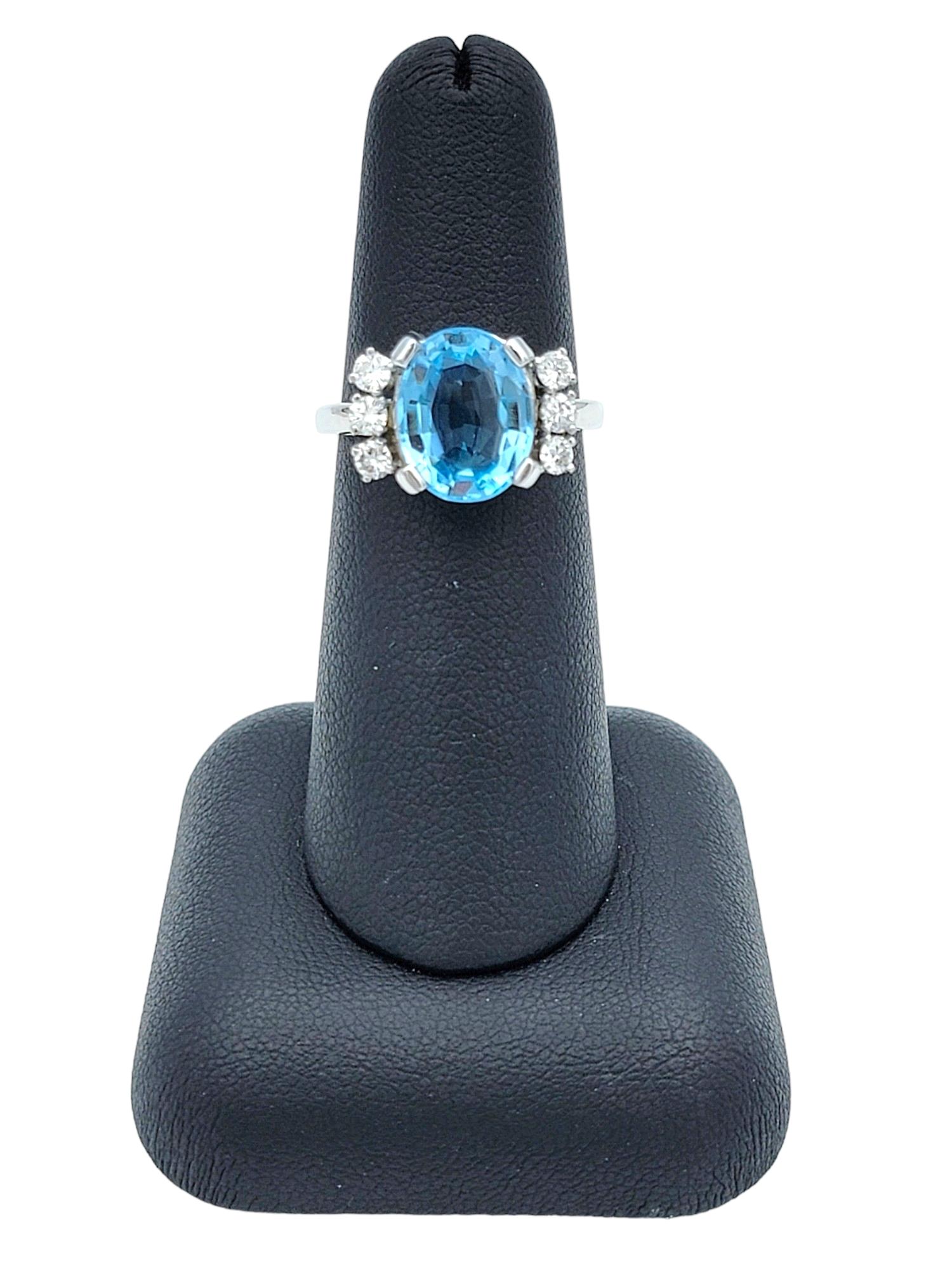 Oval Blue Topaz and Round Diamond Flanked Cocktail Ring in 14 Karat White Gold For Sale 3