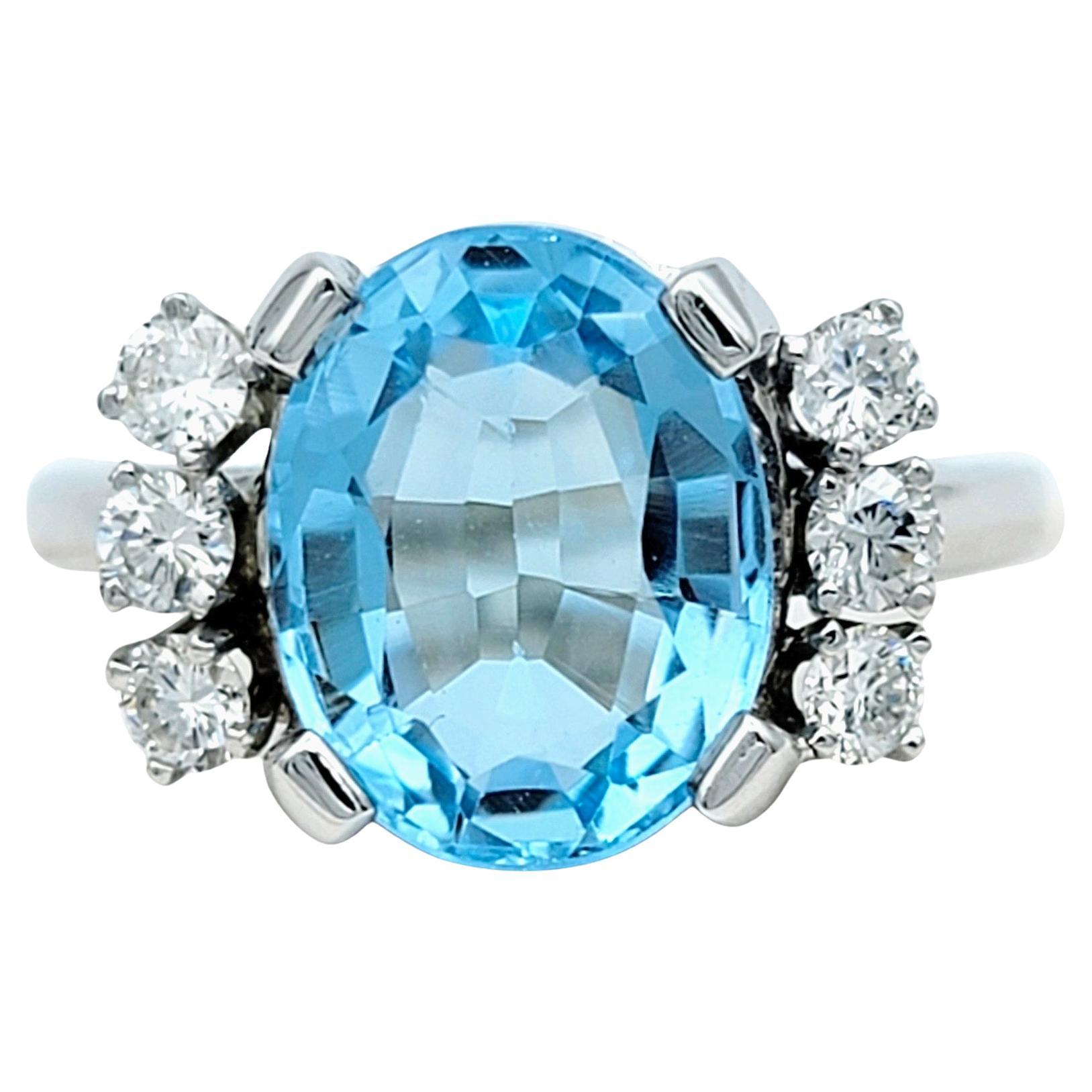 Oval Blue Topaz and Round Diamond Flanked Cocktail Ring in 14 Karat White Gold For Sale