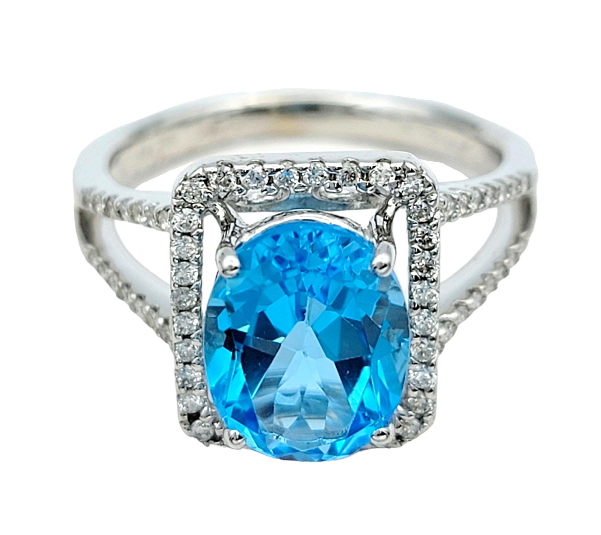 Oval Blue Topaz and Square Diamond Halo Split Shank Ring in 18 Karat White Gold In Good Condition For Sale In Scottsdale, AZ