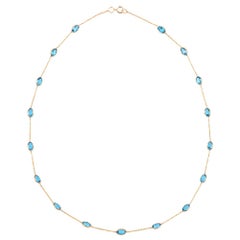 Oval Blue Topaz Bezel-Set 18 Karat Yellow Gold Necklace