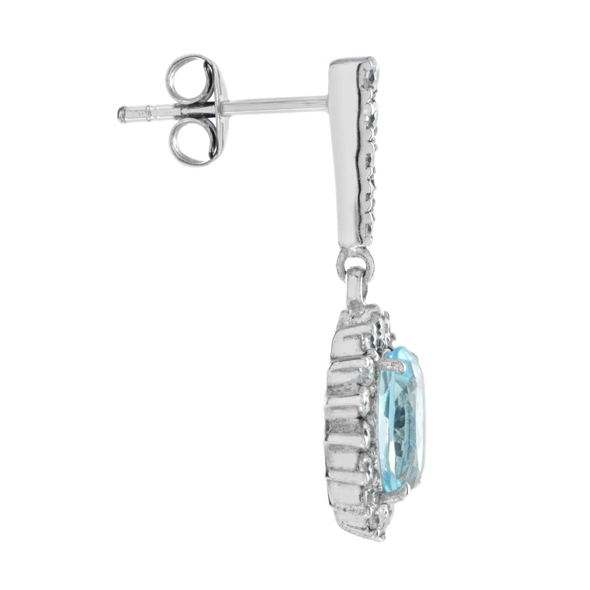 These blue topaz halo earrings are a luxurious beauty in 14K white gold. A halo of diamonds highlights the gemstone?s summery blue hue. Sparkling diamonds adorn the bale of extra brilliance. A perfect gift for your beloved one.
Information
Width: 10