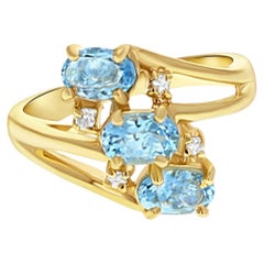 Ovaler blauer Topas Diamantring 14k Gelbgold