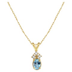 Oval Blue Topaz & Three Small Diamonds Necklace 14k Yellow Gold