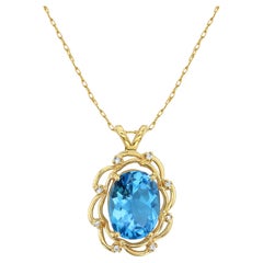 Topaze bleue ovale avec diamants en or jaune 14k