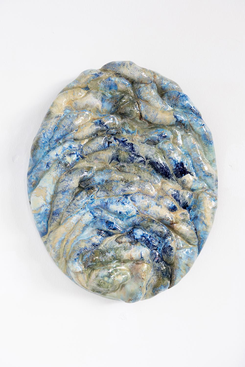 Oval blue wall sculpture by Natasja Alers, 2022
Dimensions: 40 x 7 x 30 cm
Material: ceramics

Visual artist Natasja Alers (The Hague, 1987) graduated from the Gerrit Rietveld Academy in the field of ceramics. Alers makes casts of human body