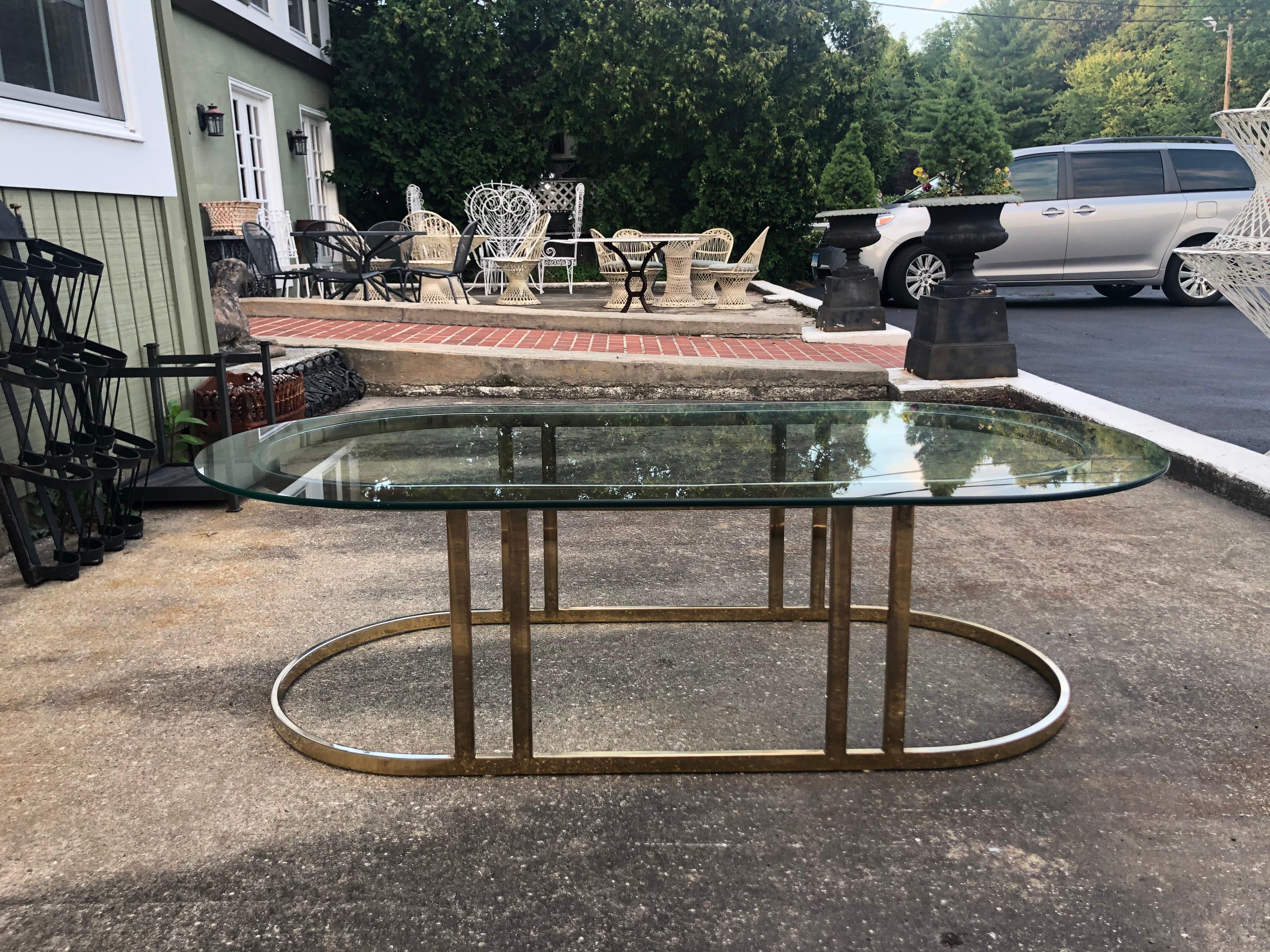 gold and glass oval coffee table