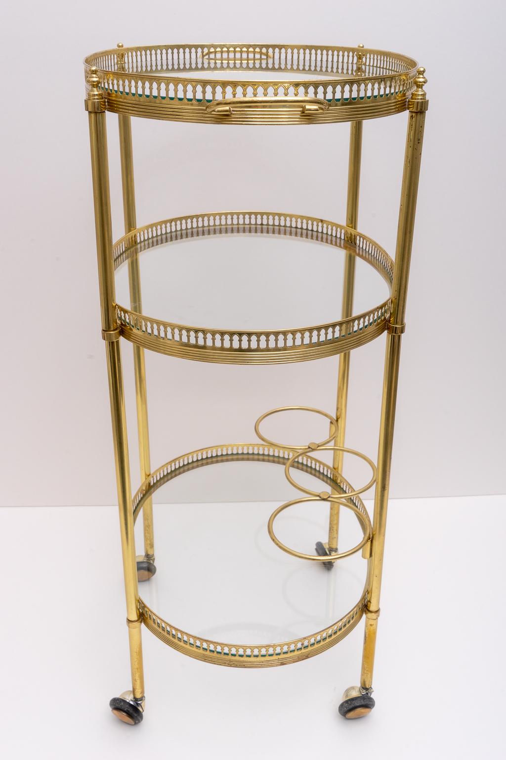 This stylish and chic petit bar cart is very much in the style of pieces created by Maison Jansen and it was purchased in Florence, Italy in the 1970s.

Note:  30