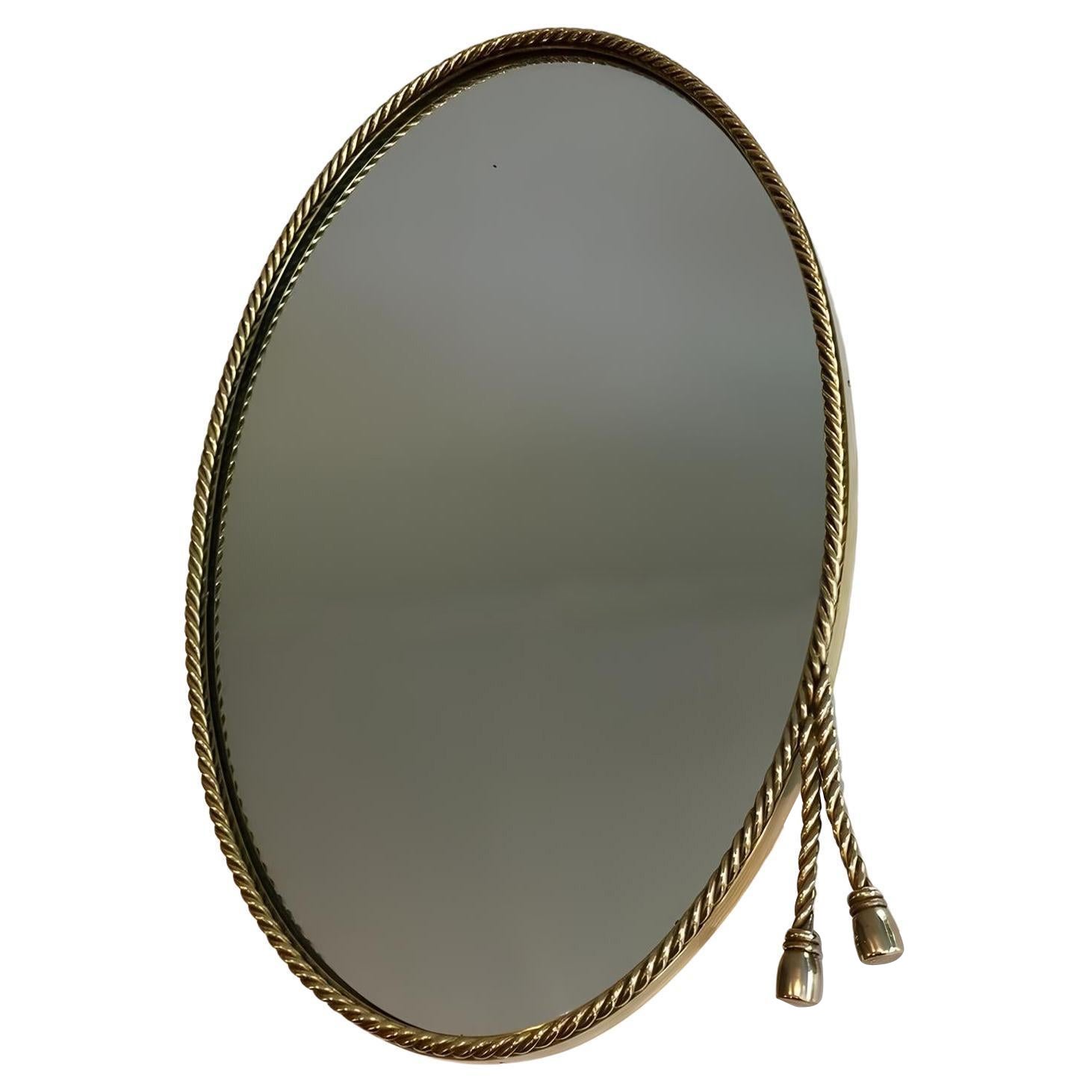 Specchio ovale in ottone circondato da una Corde Nello stile della Maison Bagués.