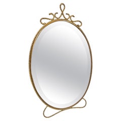 Oval Brass Vanity Mirror with Decorative Frame